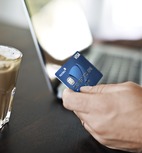 Close up of Visa card and computer